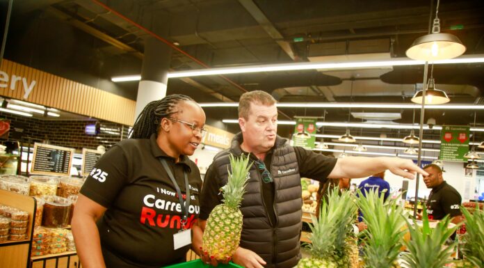 Angeline Bett, Area Manager for Carrefour Kenya and Christophe Orcet, Regional Director – East Africa at Majid Al Futtaim Retail, pictured beside a variety of pineapples during the grand opening of Carrefour's 25th store at Runda Mall