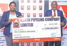 Kenya Pipeline Board Chair Faith Boinett hands over an interim dividends cheque for the half-year ended December to National Treasury CS John Mbadi at KPC headquarters, Nairobi /