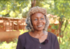 Christine Gakii is a BIMAS customer from Mukothima, Tharaka North, Tharaka Nithi County. Her journey with BIMAS Microfinance began in 2014, after her life had taken a dramatic turn. Family disputes had stripped her of everything, leaving her in a state of despair. Just when all seemed lost, a trusted friend guided her towards BIMAS Microfinance. Her journey with BIMAS began with a modest loan of Ksh 30,000, which she invested in her dream of starting a cereal farm. Through hard work and perseverance, she repaid her loans faithfully and steadily climbed the loan tiers. Her farm flourished, expanding across multiple plots of land. With courage, she ventured into a new frontier: a pork butchery with a small kitchenette. Her determination paid off, and the business thrived. Seeing her dedication, BIMAS went further, helping her acquire a motorbike to transport her products more efficiently. As her pork business grew, the daily slaughtering of pigs demanded more water. Recognizing her relentless commitment, BIMAS provided funding for a water tank and an energy saving Jiko for her kitchenette. Christine's journey is truly inspiring. Despite facing many challenges, she has risen above them all. Now, she owns a thriving pork butchery, employs many people, and has become a successful landowner and farmer. She even owns three motorbikes. Christine dreams of building rental houses on one of her best pieces of land, which is close to an institute. With BIMAS ready to help, her dream is on its way to becoming a reality. She proudly refers to BIMAS Microfinance as her "father and mother," underscoring the profound impact it has had on her life. In a heartfelt message, she encourages those facing hardships not to turn to stress-induced drinking, but to seek support from BIMAS. She says, "At BIMAS, help is available for everyone." Christine's journey with BIMAS Microfinance exemplifies women empowerment and promotes multiple Sustainable Development Goals. Through initial funding and continuous support, BIMAS enabled her to break the cycle of poverty and establish a thriving business in cereal farming and pork butchery, enhancing food security in her community. By nurturing her entrepreneurship, BIMAS promotes gender equality and economic empowerment. Moreover, Christine's enterprise generates employment opportunities and sustains livelihoods. The provision of a water tank further ensures operational efficiency and supports her overall well-being. 