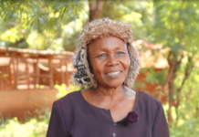 Christine Gakii is a BIMAS customer from Mukothima, Tharaka North, Tharaka Nithi County. Her journey with BIMAS Microfinance began in 2014, after her life had taken a dramatic turn. Family disputes had stripped her of everything, leaving her in a state of despair. Just when all seemed lost, a trusted friend guided her towards BIMAS Microfinance. Her journey with BIMAS began with a modest loan of Ksh 30,000, which she invested in her dream of starting a cereal farm. Through hard work and perseverance, she repaid her loans faithfully and steadily climbed the loan tiers. Her farm flourished, expanding across multiple plots of land. With courage, she ventured into a new frontier: a pork butchery with a small kitchenette. Her determination paid off, and the business thrived. Seeing her dedication, BIMAS went further, helping her acquire a motorbike to transport her products more efficiently. As her pork business grew, the daily slaughtering of pigs demanded more water. Recognizing her relentless commitment, BIMAS provided funding for a water tank and an energy saving Jiko for her kitchenette. Christine's journey is truly inspiring. Despite facing many challenges, she has risen above them all. Now, she owns a thriving pork butchery, employs many people, and has become a successful landowner and farmer. She even owns three motorbikes. Christine dreams of building rental houses on one of her best pieces of land, which is close to an institute. With BIMAS ready to help, her dream is on its way to becoming a reality. She proudly refers to BIMAS Microfinance as her "father and mother," underscoring the profound impact it has had on her life. In a heartfelt message, she encourages those facing hardships not to turn to stress-induced drinking, but to seek support from BIMAS. She says, "At BIMAS, help is available for everyone." Christine's journey with BIMAS Microfinance exemplifies women empowerment and promotes multiple Sustainable Development Goals. Through initial funding and continuous support, BIMAS enabled her to break the cycle of poverty and establish a thriving business in cereal farming and pork butchery, enhancing food security in her community. By nurturing her entrepreneurship, BIMAS promotes gender equality and economic empowerment. Moreover, Christine's enterprise generates employment opportunities and sustains livelihoods. The provision of a water tank further ensures operational efficiency and supports her overall well-being. 