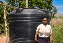 Meet Teresia, a resilient woman from Kiamuringa village in Gachoka location, Embu County who has defied adversity to secure a brighter future for her family. With five children to care for, Teresia took on the role of the family's sole provider, juggling various income streams from poultry and miraa farming to brick manufacturing. Her determination knew no bounds as she aspired to become a landlady in her community. In Kiamuringa, a semi-arid region, clean water was once a distant dream. Villagers had to trek two kilometers in search of boreholes, which often ran dry. To ensure her children's access to water, Teresia's young ones would wake up at 4 am daily to avoid the long queues, forcing Teresia's children to rise before dawn, braving long queues, their education hanging by a thread. Moreover, the exposed boreholes posed health risks due to waterborne diseases.  Frustrated by this situation, Teresia turned to BIMAS microfinance. She had been a loyal member for years, securing loans to nurture her miraa, poultry, and brick businesses. She recognized that hens, miraa, and brickmaking all demanded copious amounts of water for success. In January 2021, a ray of hope emerged as Teresia learnt that BIMAS was offering financing for water tanks to its customers. She seized this opportunity and secured a Ksh 27,000 loan to purchase and install a 4,000-liter water tank in her home. Additionally, BIMAS assisted her in acquiring a water pump worth Ksh 50,000. These investments proved to be game-changers, allowing her to operate her businesses seamlessly even during dry seasons. Today, Teresia's life has undergone an admirable transformation. She is not only a content mother but also a generous neighbor who shares her reservoir's abundance with the community. Her children's education has significantly improved as they can now focus on their studies without the burden of water-fetching. Furthermore, access to clean water has enhanced their health and overall well-being. Teresia's entrepreneurial spirit has thrived with BIMAS's support, leading to the establishment of a rental business on her property. Her success story is a proof to how access to clean water can unlock opportunities and improve lives. With a radiant smile, she expresses her gratitude, saying, "BIMAS has brought joy into my life, and I am delighted to see my neighbors benefit as well. I eagerly look forward to securing financing for another 6,000-liter water tank for my rental premises." Teresia's journey to water prosperity is an inspiration to us all.