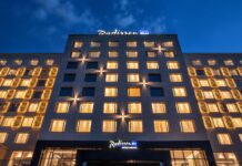 adisson Blu has once again secured top honors at the World Travel Awards Africa, taking the title of “Africa’s Leading Hotel Brand” for 2025. This win marks the fourth consecutive year the upperupscale brand has claimed the region’s most prestigious hospitality award, reinforcing its position as an industry leader across the continent. At the same ceremony, Radisson Hotel Group (www.RadissonHotels.com) properties picked up 14 more trophies, led by Africa’s Leading Conference Hotel for Radisson Blu Hotel & Convention Centre, Kigali and swept country awards in Côte d’Ivoire, Gabon, Kenya, Mali, Niger, Rwanda, and Senegal. A heritage of design, service, and growth The Group’s journey began in 1960 with the opening of the world’s first designer hotel in Copenhagen, Denmark. That hotel, now the Radisson Collection Royal Hotel, Copenhagen, is still operating successfully. Since then, Radisson Hotel Group has expanded to ten distinctive brands, with Radisson Blu at its core. In Africa, the Group entered in 2000 with the opening of Radisson Blu Hotel, Waterfront in Cape Town. which has now transitioned to Radisson Collection Hotel, Waterfront Cape Town. Accelerating across Africa Over the past fifteen months, the Group has signed eleven hotels and opened seven, bringing its African portfolio to 100 hotels in more than 30 countries and cementing its status as the continent’s most active international operator. Radisson Blu continues to drive much of that momentum, from Casablanca to Cape Town. Recent highlights include the opening of the Radisson Blu Hotel, Conakry, just three months after signing, as well as new signings, including the Radisson Blu Hotel & Apartments, Yaoundé. Scheduled to open by the end of 2026, the Radisson Blu Hotel, Kinshasa is opening late 2026 “Our teams live and breathe purposeful hospitality, and this award shows how consistently they deliver,” says Tim Cordon, Chief Operating Officer for the Middle East, Africa, and Southeast Asia Pacific at Radisson Hotel Group. “Winning four years in a row isn’t luck. It reflects a clear strategy, strong local partnerships, and a brand culture that turns every stay into a memorable moment. We’re already the most diverse hotel company on the continent, operating in more than 30 African countries, and we’re just getting started. Africa sits at the heart of our growth plans, and guests can expect even more thoughtfully designed Radisson Blu hotels to open their doors soon.” Looking ahead Across its ten brands, Radisson Hotel Group, is on track to reaching 150 hotels by 2030 in Africa and will continue to pair global standards with genuine local insight.