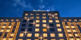 adisson Blu has once again secured top honors at the World Travel Awards Africa, taking the title of “Africa’s Leading Hotel Brand” for 2025. This win marks the fourth consecutive year the upperupscale brand has claimed the region’s most prestigious hospitality award, reinforcing its position as an industry leader across the continent. At the same ceremony, Radisson Hotel Group (www.RadissonHotels.com) properties picked up 14 more trophies, led by Africa’s Leading Conference Hotel for Radisson Blu Hotel & Convention Centre, Kigali and swept country awards in Côte d’Ivoire, Gabon, Kenya, Mali, Niger, Rwanda, and Senegal. A heritage of design, service, and growth The Group’s journey began in 1960 with the opening of the world’s first designer hotel in Copenhagen, Denmark. That hotel, now the Radisson Collection Royal Hotel, Copenhagen, is still operating successfully. Since then, Radisson Hotel Group has expanded to ten distinctive brands, with Radisson Blu at its core. In Africa, the Group entered in 2000 with the opening of Radisson Blu Hotel, Waterfront in Cape Town. which has now transitioned to Radisson Collection Hotel, Waterfront Cape Town. Accelerating across Africa Over the past fifteen months, the Group has signed eleven hotels and opened seven, bringing its African portfolio to 100 hotels in more than 30 countries and cementing its status as the continent’s most active international operator. Radisson Blu continues to drive much of that momentum, from Casablanca to Cape Town. Recent highlights include the opening of the Radisson Blu Hotel, Conakry, just three months after signing, as well as new signings, including the Radisson Blu Hotel & Apartments, Yaoundé. Scheduled to open by the end of 2026, the Radisson Blu Hotel, Kinshasa is opening late 2026 “Our teams live and breathe purposeful hospitality, and this award shows how consistently they deliver,” says Tim Cordon, Chief Operating Officer for the Middle East, Africa, and Southeast Asia Pacific at Radisson Hotel Group. “Winning four years in a row isn’t luck. It reflects a clear strategy, strong local partnerships, and a brand culture that turns every stay into a memorable moment. We’re already the most diverse hotel company on the continent, operating in more than 30 African countries, and we’re just getting started. Africa sits at the heart of our growth plans, and guests can expect even more thoughtfully designed Radisson Blu hotels to open their doors soon.” Looking ahead Across its ten brands, Radisson Hotel Group, is on track to reaching 150 hotels by 2030 in Africa and will continue to pair global standards with genuine local insight.
