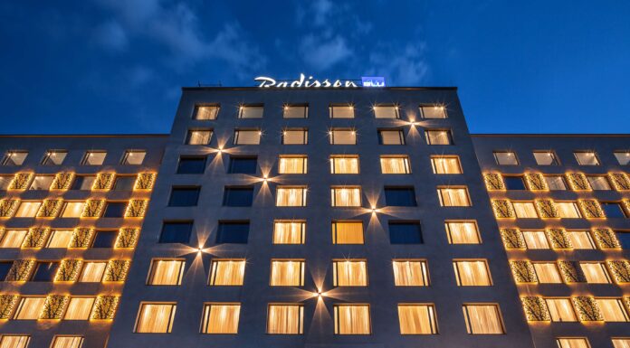 Radisson Blu named “Africa’s Leading Hotel Brand” for the fourth consecutive year adisson Blu has once again secured top honors at the World Travel Awards Africa, taking the title of “Africa’s Leading Hotel Brand” for 2025. This win marks the fourth consecutive year the upperupscale brand has claimed the region’s most prestigious hospitality award, reinforcing its position as an industry leader across the continent. At the same ceremony, Radisson Hotel Group (www.RadissonHotels.com) properties picked up 14 more trophies, led by Africa’s Leading Conference Hotel for Radisson Blu Hotel & Convention Centre, Kigali and swept country awards in Côte d’Ivoire, Gabon, Kenya, Mali, Niger, Rwanda, and Senegal. A heritage of design, service, and growth The Group’s journey began in 1960 with the opening of the world’s first designer hotel in Copenhagen, Denmark. That hotel, now the Radisson Collection Royal Hotel, Copenhagen, is still operating successfully. Since then, Radisson Hotel Group has expanded to ten distinctive brands, with Radisson Blu at its core. In Africa, the Group entered in 2000 with the opening of Radisson Blu Hotel, Waterfront in Cape Town. which has now transitioned to Radisson Collection Hotel, Waterfront Cape Town. Accelerating across Africa Over the past fifteen months, the Group has signed eleven hotels and opened seven, bringing its African portfolio to 100 hotels in more than 30 countries and cementing its status as the continent’s most active international operator. Radisson Blu continues to drive much of that momentum, from Casablanca to Cape Town. Recent highlights include the opening of the Radisson Blu Hotel, Conakry, just three months after signing, as well as new signings, including the Radisson Blu Hotel & Apartments, Yaoundé. Scheduled to open by the end of 2026, the Radisson Blu Hotel, Kinshasa is opening late 2026 “Our teams live and breathe purposeful hospitality, and this award shows how consistently they deliver,” says Tim Cordon, Chief Operating Officer for the Middle East, Africa, and Southeast Asia Pacific at Radisson Hotel Group. “Winning four years in a row isn’t luck. It reflects a clear strategy, strong local partnerships, and a brand culture that turns every stay into a memorable moment. We’re already the most diverse hotel company on the continent, operating in more than 30 African countries, and we’re just getting started. Africa sits at the heart of our growth plans, and guests can expect even more thoughtfully designed Radisson Blu hotels to open their doors soon.” Looking ahead Across its ten brands, Radisson Hotel Group, is on track to reaching 150 hotels by 2030 in Africa and will continue to pair global standards with genuine local insight.