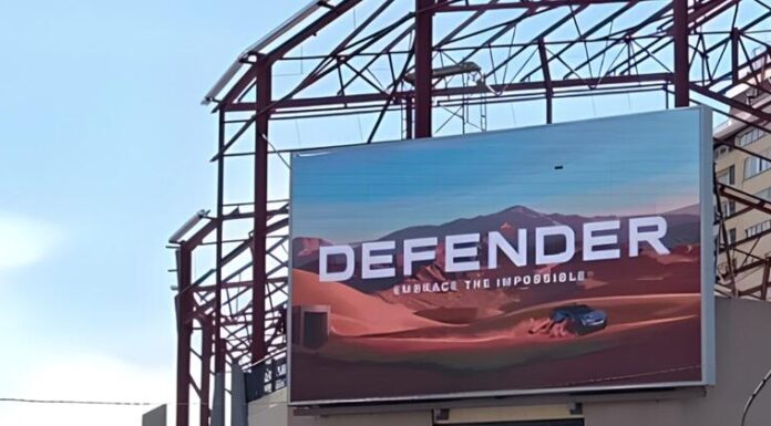 Polygon (https://PDOOH.co.za/), Africa’s leading and largest programmatic aggregated digital out-of-home (DOOH) publisher network has launched its first programmatic DOOH (pDOOH) campaign in Kenya for luxury automotive brand Jaguar Land Rover (JLR). The campaign, executed in partnership with Polygon’s technology provider Place Exchange and media agency Omnicom Media Group (OMG), celebrates JLR’s 55-year anniversary and showcases the latest Defender model. However, it also represents another important milestone for the Kenyan advertising landscape, as the first locally-activated pDOOH campaign to run through Google-based trading tools. “This is a watershed moment for both the Kenyan and broader African DOOH markets, says Remi du Preez, Managing Director at Polygon. “It demonstrates how international brands can now transact programmatically across our network using the same digital platforms they rely on globally, bringing true omnichannel capability to Africa.” The JLR campaign currently focuses on Nairobi, targeting affluent suburbs, upmarket malls and Jomo Kenyatta International Airport. Initially launched across a limited number of sites, the rollout will soon expand to around 50 premium screens. While Kenya’s OOH market is smaller than South Africa’s, it remains one of Africa’s top five regions for outdoor media, with a fast-growing digital footprint and increasing advertiser appetite, says Du Preez. “The local market’s sentiment toward DOOH has shifted dramatically over the past few years. As advertisers see its value and measurability, media owners are incentivised to build and convert more digital inventory which, in turn, enables programmatic trading to thrive.” For JLR, the campaign forms part of a broader omnichannel strategy, where optimisation and attribution play key roles. Through Polygon’s programmatic model which enables day-part targeting, the client can reduce wastage by serving in specific pockets of time and maximising their budget. “The ability to dynamically serve ads, monitor engagement and adjust in real-time delivers to avoid wastage brings a level of agility that traditional loop-based buying can’t match,” says Du Preez. Polygon leverages Place Exchange (PX) as its core inventory exchange for all programmatic transactions across Africa. PX’s integration with Google’s ecosystem bridges the gap between global buyers and local media owners, allowing advertisers to simply activate, pause or manage campaigns across multiple African markets. “Through Place Exchange, we’ve created an infrastructure where brands like Jaguar Land Rover can extend their global programmatic strategy into Africa, with the same efficiency, measurability and transparency they expect elsewhere,” explains Du Preez. With nine African countries already connected to its network – and more being added –Polygon’s vision is to entrench its position as Africa’s largest DOOH network, offering advertisers a single entry point into a fragmented market while unlocking new revenue streams for local media owners. “This campaign is a testament to how far we’ve come. We’re proud to be driving innovation that not only connects global brands to African audiences, but also strengthens local ecosystems while speeding up digital transformation across the continent,” Du Preez says.