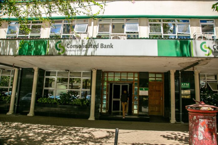 Consolidated-Bank-HQ-1-2048x1365 “This performance demonstrates the impact of the strategic efficiency measures we implemented across the business, which have enabled significant cost savings. Maintaining these efficiency levels will remain a priority going forward,” said acting Chief Executive Officer Dominic Murage. “Small and Medium Enterprises (SMEs) remain central to our business model and portfolio, and we intend to deepen our support for them. Additionally, as a government-owned institution, we are uniquely positioned to support public sector financing needs. We aim to strengthen our collaboration with government agencies, parastatals, universities and ministries to position Consolidated Bank as the preferred banking partner for the public sector,” he added. The bank’s total assets grew by 11 percent to Sh19.5 billion from Sh17.5 billion in 2024, driven largely by a 29 percent increase in investments in government securities to Sh8.2 billion from Sh6.4 billion.