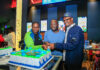From Left: KCB Regional Business Manager, Moi Avenue Branch - Leah Choge, Joshua Ochieng (a parent) and Senior Business Development Manager, Personal Banking, Nelson Wanyonyi, cut a cake to commemorate the launch of KCB Under 18 Proposition at Garden City Mall, Nairobi.
