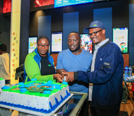 From Left: KCB Regional Business Manager, Moi Avenue Branch - Leah Choge, Joshua Ochieng (a parent) and Senior Business Development Manager, Personal Banking, Nelson Wanyonyi, cut a cake to commemorate the launch of KCB Under 18 Proposition at Garden City Mall, Nairobi.