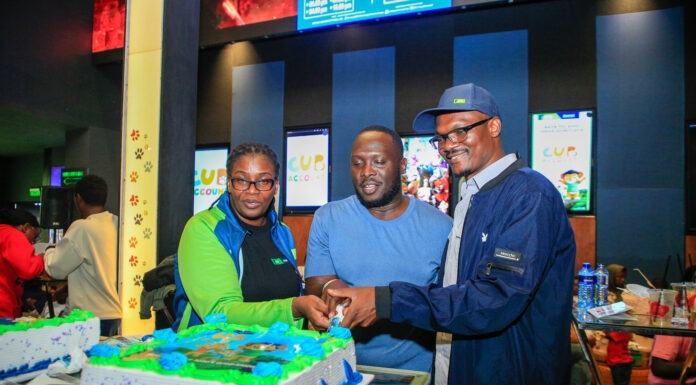 From Left: KCB Regional Business Manager, Moi Avenue Branch - Leah Choge, Joshua Ochieng (a parent) and Senior Business Development Manager, Personal Banking, Nelson Wanyonyi, cut a cake to commemorate the launch of KCB Under 18 Proposition at Garden City Mall, Nairobi.