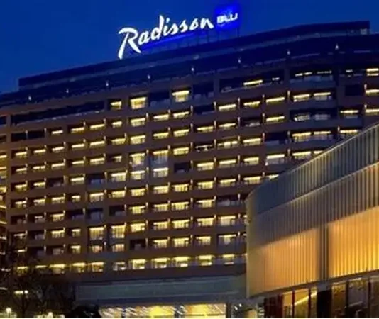 Radisson Hotel Group has reached a significant milestone in Africa, with more than 100 hotels across the continent in operation and under development. Radisson Blu continues to anchor the legacy footprint. At the same time, the Radisson brand is the fastest riser, supported by a strong conversion engine and a concrete pipeline that continues to translate into openings. Building on this momentum, the Group has signed over 15 new hotels and roughly 2,500 rooms in the last 12 months, including new market entries in the Democratic Republic of Congo and Zimbabwe. This week, Radisson Hotel Group is also attending FHS Africa (www.FutureHospitality.com) in Nairobi, reinforcing its commitment to expanding its presence and strengthening strategic partnerships across the continent. Over the past five years, Radisson and Radisson Blu have ranked among the most signed brands in Africa, with one of the highest shares of cumulative openings. The last 12 months set a new benchmark with more than 2,500 rooms signed and multiple market entries. Priority growth markets remain Morocco, South Africa, and Nigeria, where the Group is deepening its presence and widening its brand distribution. Ramsay Rankoussi, Regional Chief Development Officer, Radisson Hotel Group, commented: “We’ve crossed the 100-hotel mark in Africa by staying true to our plan, focusing on where we can lead, moving fast on quality conversions, and partnering with owners who share our ambition. The next phase is about depth in Morocco and Nigeria, a smarter footprint in South Africa, and a stronger resort offering that matches where travelers want to go. Our pipeline is built to open, not just to announce. That is why our conversion share is high, our time to market is short, and our brands are gaining ground in the cities and resort destinations that matter most.” Nigeria shows the model’s resilience. The Group now holds a strong position in the country with 13 hotels in operation and pipeline, while Abuja is carrying a significant active pipeline with three hotels totaling 458 keys. South Africa is being reshaped with priorities in Cape Town, targeted growth in secondary cities such as Durban and Pretoria, and a sharper focus on leisure corridors that include Kruger National Park, Sun City, and the Garden Route. The Group plans to enter Zanzibar and is considering lodge, safari, and affiliation opportunities across Namibia, Botswana, and Zambia to meet the rising demand for nature-led experiences. Conversions remain a core lever for scale and speed. In the last five years, more than 15 hotels, equal to almost 3,000 rooms, joined the portfolio through conversion. This helped the Group lead openings across the continent while keeping brand standards high and owners in mind. Recent signings show the extensiveness of this strategy, with a balanced pipeline of city hotels, resort destinations, and quick-to-market conversions. These signings span the Democratic Republic of Congo, Nigeria, Zimbabwe, and Morocco, including Radisson Blu Kinshasa and three Radisson hotels in Lubumbashi, Radisson Harare, Park Inn Victoria Falls, Radisson Collection Lagos Atlantic, as well as new additions in Casablanca with Radisson Blu Resort & Conference Center Bouskoura, a first Radisson brand hotel in Rabat, and further expansion in Marrakech. Key signings include: Democratic Republic of the Congo Radisson Blu Hotel, Kinshasa Upper-upscale flagship in Gombe Opening late 2026. Set on Boulevard Colonel Tshatshi in the Gombe district, the hotel will offer 110 keys, including suites and a Presidential Suite. Guests can choose from a lobby bar, an all-day dining restaurant, and a pool bar. Wellness includes a gym, massage rooms, and an outdoor pool with a terrace. Meetings and events feature a modern event hall with a pre-function area. The address is well connected, 32 kilometers from N’djili International Airport, 10 kilometers from N’Dolo Airport, and 6 kilometers from Gare Centrale. Radisson Hotel Lubumbashi Panoramic city stay in the DRC’s second city Opening mid-2027. Located on Revolution Road Avenue, the hotel will feature 97 keys, including junior suites and a Presidential Suite. Dining spans a lobby bar, an all-day dining venue, and a rooftop bar and grill with city views. Three flexible meeting rooms and a pre-function area support business and social events. Facilities include a gym and a swimming pool. The location sits near Kipopo Lake, Lubumbashi Golf Club, and La Plage, and is 12 kilometers from Luano International Airport. Radisson Blu Apartments Lubumbashi Upscale apartment living in Lubumbashi’s prestigious Quartier Golf Targeted for 2030. A 160-room property located in Quartier Golf, one of Lubumbashi’s most upscale residential districts, near Kipopo Lake and surrounded by luxury homes and key landmarks including Lubumbashi Golf and La Plage. Planned amenities include a specialty restaurant and bar, a pool bar, and a gym, offering a premium stay experience for extended-stay and leisure travelers. Radisson Airport Hotel Lubumbashi A strategically located airport hotel designed for ease and connectivity Set to open in 2028, this 105-room property will be located just 6 kilometers from Luano International Airport, around a 10-minute drive, making it well positioned for business travelers, transit guests, and airline crews. Planned facilities include a restaurant, lobby bar, pool bar, meeting rooms, and a swimming pool, combining practicality with a welcoming hospitality experience close to the airport. Egypt Radisson Resort Ain Sokhna Groove A large-scale Red Sea resort in one of Egypt’s growing leisure destinations Planned for 2029, Radisson Resort Ain Sokhna Groove will offer 469 rooms, including 50 family rooms, as part of The Groove Ain Sokhna mixed-use development. Located along the Red Sea coast, around 30 kilometers south of Ain Sokhna and approximately 150 kilometers from Cairo, the resort is expected to feature private beach access, a spa, gym and fitness center, several restaurants, plus a ballroom and meeting rooms, catering to both holidaymakers and events demand. Radisson Serviced Apartments COY Sheikh Zayed City Flexible extended-stay accommodation in a fast-growing hub of Greater Cairo Expected to open in 2030, this 120-key serviced apartments property, including six one-bedroom units, will form part of the COY development in Sheikh Zayed City. With a location just 13 kilometers from Sphinx International Airport and 14 kilometers from the Great Pyramids of Giza, the development sits close to major commercial, leisure, education, and healthcare destinations. Planned amenities include a coffee lounge, bar, kiosk, and meeting and event space integrated into the wider co-working environment. Morocco Radisson Blu Hotel & Conference Center, Casablanc a Bouskoura Conference-ready address beside Palm Golf A 119-key hotel with eight suites, a rooftop restaurant, and a dedicated conference center. Event facilities include two boardrooms, while a spa and a large outdoor pool cater to leisure travelers. The hotel is located 20 kilometers from Mohammed V International Airport and next to Palm Golf Palmeraie Country Club. Radisson Hotel & Apartments Rabat Technopolis Dual-component hub in the capital’s innovation park A two-building project in Technopolis, 25 minutes from central Rabat. The hotel will offer 140 rooms, four dining venues, a pool, and a meeting and events space. The adjacent serviced apartment building adds 56 units. Technopolis connects businesses with leading education and research centers, creating a strong base for corporate demand. Radisson Blu Resort Marrakech Ben Akil Low-rise bungalows with views of Atlas Mountains Opening early 2028. A 17-hectare estate featuring 80 bungalow-style accommodations, each with an outdoor terrace. Larger typologies include private pools. The resort sits beside Royal Golf Marrakech and is a 15-minute drive from the city center. Nigeria Radisson Hotel Aba A new internationally branded hospitality destination for Aba Targeted for 2031, Radisson Hotel Aba will introduce 120 rooms, including six junior suites, in a prime riverside location along the Aba River near key transport corridors. The hotel will become the first Radisson-branded property in Aba and the Group’s third branded hotel in Nigeria. Plans for the hotel include a gym, swimming pool, and several meeting rooms, serving both business and local demand. Sam Mbakwe International Airport in Owerri is approximately 56 kilometers away, or a 1 hour and 10 minute drive. Radisson Hotel & Conference Center Yenagoa A conference-focused hotel in the heart of an emerging Nigerian business center Scheduled for 2027, the property will feature 196 rooms, including 16 junior suites, four executive suites, and two Presidential Suites, in Yenagoa, a city that is steadily strengthening its role as an administrative and commercial hub in southern Nigeria. Located near government institutions, business districts, and Bayelsa International Airport, approximately 33 kilometers or 40 minutes away, the hotel is set to benefit from the area’s ongoing infrastructure and hospitality growth while meeting rising demand for accommodation, meetings, and large-scale events. Radisson Collection Hotel, Lagos Atlantic Refined lifestyle luxury on the oceanfront of Lagos’ leading business district Targeted for 2029, Radisson Collection Hotel, Lagos Atlantic will feature 107 rooms, including 16 executive suites and one Presidential Suite, on a prime oceanfront site on Victoria Island. As Lagos’ main financial and commercial district, Victoria Island is home to multinational companies, corporate headquarters, embassies, and strong year-round business activity. Located approximately 33 kilometers from Murtala Muhammed International Airport, around a 45-minute drive, the hotel will mark the second Radisson Collection property in Lagos. South Africa Radisson Serviced Apartments Umhlanga A modern serviced apartment offering in the heart of Umhlanga’s business district Planned for 2029, Radisson Serviced Apartments Umhlanga will introduce 155 rooms in a newly built development within Umhlanga Ridge, one of the area’s most established commercial and lifestyle hubs. The property will be within walking distance of Gateway Theatre of Shopping and close to major office precincts, including Umhlanga Ridge Business Park, La Lucia Office Park, and Glass House Office Park. Comprising studios and apartments, the project is designed to meet growing demand for high-quality extended-stay accommodation in the district. Zimbabwe New market entry Radisson Serviced Apartments, Harare Prime Borrowdale address for extended stays Targeted for end-2028. A 147-key serviced apartments project within a master development near Maxwell Road in Borrowdale. The neighborhood is known for luxury residences, upscale shopping at Sam Levy’s Village, and entertainment at Borrowdale Racecourse. Planned amenities include a café and bar, a gym with sauna, and a pool with a deck. Set to be the only internationally branded hotel apartment offering in the area. Park Inn by Radisson Victoria Falls Resort A resort destination near one of the world’s most iconic natural landmarks Expected to open in 2029, Park Inn by Radisson Victoria Falls Resort will offer 150 rooms, including five suites, in a setting overlooking Zambezi National Park. Located just 5 kilometers from Victoria Falls, around a 10-minute drive, the resort will be ideally positioned near one of the Seven Natural Wonders of the World, a destination that attracts more than 350,000 international visitors each year. With year-round waterfall views, adventure tourism, and access to safari experiences in the surrounding national parks, the property will cater to both leisure travelers and tour groups. Victoria Falls Airport is located approximately 22 kilometers, or a 23-minute drive, away. Leading with the most diverse footprint across the continent, with presence in more than 30 African countries, Radisson Hotel Group blends depth in focus markets with selective entry into new destinations each year.