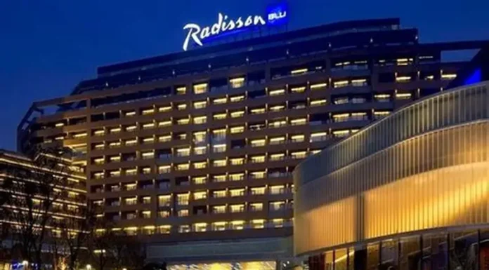Radisson Hotel Group Surpasses 100 Hotels in Africa, Accelerating 2030 Growth Ambition Radisson Hotel Group has reached a significant milestone in Africa, with more than 100 hotels across the continent in operation and under development. Radisson Blu continues to anchor the legacy footprint. At the same time, the Radisson brand is the fastest riser, supported by a strong conversion engine and a concrete pipeline that continues to translate into openings. Building on this momentum, the Group has signed over 15 new hotels and roughly 2,500 rooms in the last 12 months, including new market entries in the Democratic Republic of Congo and Zimbabwe. This week, Radisson Hotel Group is also attending FHS Africa (www.FutureHospitality.com) in Nairobi, reinforcing its commitment to expanding its presence and strengthening strategic partnerships across the continent. Over the past five years, Radisson and Radisson Blu have ranked among the most signed brands in Africa, with one of the highest shares of cumulative openings. The last 12 months set a new benchmark with more than 2,500 rooms signed and multiple market entries. Priority growth markets remain Morocco, South Africa, and Nigeria, where the Group is deepening its presence and widening its brand distribution. Ramsay Rankoussi, Regional Chief Development Officer, Radisson Hotel Group, commented: “We’ve crossed the 100-hotel mark in Africa by staying true to our plan, focusing on where we can lead, moving fast on quality conversions, and partnering with owners who share our ambition. The next phase is about depth in Morocco and Nigeria, a smarter footprint in South Africa, and a stronger resort offering that matches where travelers want to go. Our pipeline is built to open, not just to announce. That is why our conversion share is high, our time to market is short, and our brands are gaining ground in the cities and resort destinations that matter most.” Nigeria shows the model’s resilience. The Group now holds a strong position in the country with 13 hotels in operation and pipeline, while Abuja is carrying a significant active pipeline with three hotels totaling 458 keys. South Africa is being reshaped with priorities in Cape Town, targeted growth in secondary cities such as Durban and Pretoria, and a sharper focus on leisure corridors that include Kruger National Park, Sun City, and the Garden Route. The Group plans to enter Zanzibar and is considering lodge, safari, and affiliation opportunities across Namibia, Botswana, and Zambia to meet the rising demand for nature-led experiences. Conversions remain a core lever for scale and speed. In the last five years, more than 15 hotels, equal to almost 3,000 rooms, joined the portfolio through conversion. This helped the Group lead openings across the continent while keeping brand standards high and owners in mind. Recent signings show the extensiveness of this strategy, with a balanced pipeline of city hotels, resort destinations, and quick-to-market conversions. These signings span the Democratic Republic of Congo, Nigeria, Zimbabwe, and Morocco, including Radisson Blu Kinshasa and three Radisson hotels in Lubumbashi, Radisson Harare, Park Inn Victoria Falls, Radisson Collection Lagos Atlantic, as well as new additions in Casablanca with Radisson Blu Resort & Conference Center Bouskoura, a first Radisson brand hotel in Rabat, and further expansion in Marrakech. Key signings include: Democratic Republic of the Congo Radisson Blu Hotel, Kinshasa Upper-upscale flagship in Gombe Opening late 2026. Set on Boulevard Colonel Tshatshi in the Gombe district, the hotel will offer 110 keys, including suites and a Presidential Suite. Guests can choose from a lobby bar, an all-day dining restaurant, and a pool bar. Wellness includes a gym, massage rooms, and an outdoor pool with a terrace. Meetings and events feature a modern event hall with a pre-function area. The address is well connected, 32 kilometers from N’djili International Airport, 10 kilometers from N’Dolo Airport, and 6 kilometers from Gare Centrale. Radisson Hotel Lubumbashi Panoramic city stay in the DRC’s second city Opening mid-2027. Located on Revolution Road Avenue, the hotel will feature 97 keys, including junior suites and a Presidential Suite. Dining spans a lobby bar, an all-day dining venue, and a rooftop bar and grill with city views. Three flexible meeting rooms and a pre-function area support business and social events. Facilities include a gym and a swimming pool. The location sits near Kipopo Lake, Lubumbashi Golf Club, and La Plage, and is 12 kilometers from Luano International Airport. Radisson Blu Apartments Lubumbashi Upscale apartment living in Lubumbashi’s prestigious Quartier Golf Targeted for 2030. A 160-room property located in Quartier Golf, one of Lubumbashi’s most upscale residential districts, near Kipopo Lake and surrounded by luxury homes and key landmarks including Lubumbashi Golf and La Plage. Planned amenities include a specialty restaurant and bar, a pool bar, and a gym, offering a premium stay experience for extended-stay and leisure travelers. Radisson Airport Hotel Lubumbashi A strategically located airport hotel designed for ease and connectivity Set to open in 2028, this 105-room property will be located just 6 kilometers from Luano International Airport, around a 10-minute drive, making it well positioned for business travelers, transit guests, and airline crews. Planned facilities include a restaurant, lobby bar, pool bar, meeting rooms, and a swimming pool, combining practicality with a welcoming hospitality experience close to the airport. Egypt Radisson Resort Ain Sokhna Groove A large-scale Red Sea resort in one of Egypt’s growing leisure destinations Planned for 2029, Radisson Resort Ain Sokhna Groove will offer 469 rooms, including 50 family rooms, as part of The Groove Ain Sokhna mixed-use development. Located along the Red Sea coast, around 30 kilometers south of Ain Sokhna and approximately 150 kilometers from Cairo, the resort is expected to feature private beach access, a spa, gym and fitness center, several restaurants, plus a ballroom and meeting rooms, catering to both holidaymakers and events demand. Radisson Serviced Apartments COY Sheikh Zayed City Flexible extended-stay accommodation in a fast-growing hub of Greater Cairo Expected to open in 2030, this 120-key serviced apartments property, including six one-bedroom units, will form part of the COY development in Sheikh Zayed City. With a location just 13 kilometers from Sphinx International Airport and 14 kilometers from the Great Pyramids of Giza, the development sits close to major commercial, leisure, education, and healthcare destinations. Planned amenities include a coffee lounge, bar, kiosk, and meeting and event space integrated into the wider co-working environment. Morocco Radisson Blu Hotel & Conference Center, Casablanc a Bouskoura Conference-ready address beside Palm Golf A 119-key hotel with eight suites, a rooftop restaurant, and a dedicated conference center. Event facilities include two boardrooms, while a spa and a large outdoor pool cater to leisure travelers. The hotel is located 20 kilometers from Mohammed V International Airport and next to Palm Golf Palmeraie Country Club. Radisson Hotel & Apartments Rabat Technopolis Dual-component hub in the capital’s innovation park A two-building project in Technopolis, 25 minutes from central Rabat. The hotel will offer 140 rooms, four dining venues, a pool, and a meeting and events space. The adjacent serviced apartment building adds 56 units. Technopolis connects businesses with leading education and research centers, creating a strong base for corporate demand. Radisson Blu Resort Marrakech Ben Akil Low-rise bungalows with views of Atlas Mountains Opening early 2028. A 17-hectare estate featuring 80 bungalow-style accommodations, each with an outdoor terrace. Larger typologies include private pools. The resort sits beside Royal Golf Marrakech and is a 15-minute drive from the city center. Nigeria Radisson Hotel Aba A new internationally branded hospitality destination for Aba Targeted for 2031, Radisson Hotel Aba will introduce 120 rooms, including six junior suites, in a prime riverside location along the Aba River near key transport corridors. The hotel will become the first Radisson-branded property in Aba and the Group’s third branded hotel in Nigeria. Plans for the hotel include a gym, swimming pool, and several meeting rooms, serving both business and local demand. Sam Mbakwe International Airport in Owerri is approximately 56 kilometers away, or a 1 hour and 10 minute drive. Radisson Hotel & Conference Center Yenagoa A conference-focused hotel in the heart of an emerging Nigerian business center Scheduled for 2027, the property will feature 196 rooms, including 16 junior suites, four executive suites, and two Presidential Suites, in Yenagoa, a city that is steadily strengthening its role as an administrative and commercial hub in southern Nigeria. Located near government institutions, business districts, and Bayelsa International Airport, approximately 33 kilometers or 40 minutes away, the hotel is set to benefit from the area’s ongoing infrastructure and hospitality growth while meeting rising demand for accommodation, meetings, and large-scale events. Radisson Collection Hotel, Lagos Atlantic Refined lifestyle luxury on the oceanfront of Lagos’ leading business district Targeted for 2029, Radisson Collection Hotel, Lagos Atlantic will feature 107 rooms, including 16 executive suites and one Presidential Suite, on a prime oceanfront site on Victoria Island. As Lagos’ main financial and commercial district, Victoria Island is home to multinational companies, corporate headquarters, embassies, and strong year-round business activity. Located approximately 33 kilometers from Murtala Muhammed International Airport, around a 45-minute drive, the hotel will mark the second Radisson Collection property in Lagos. South Africa Radisson Serviced Apartments Umhlanga A modern serviced apartment offering in the heart of Umhlanga’s business district Planned for 2029, Radisson Serviced Apartments Umhlanga will introduce 155 rooms in a newly built development within Umhlanga Ridge, one of the area’s most established commercial and lifestyle hubs. The property will be within walking distance of Gateway Theatre of Shopping and close to major office precincts, including Umhlanga Ridge Business Park, La Lucia Office Park, and Glass House Office Park. Comprising studios and apartments, the project is designed to meet growing demand for high-quality extended-stay accommodation in the district. Zimbabwe New market entry Radisson Serviced Apartments, Harare Prime Borrowdale address for extended stays Targeted for end-2028. A 147-key serviced apartments project within a master development near Maxwell Road in Borrowdale. The neighborhood is known for luxury residences, upscale shopping at Sam Levy’s Village, and entertainment at Borrowdale Racecourse. Planned amenities include a café and bar, a gym with sauna, and a pool with a deck. Set to be the only internationally branded hotel apartment offering in the area. Park Inn by Radisson Victoria Falls Resort A resort destination near one of the world’s most iconic natural landmarks Expected to open in 2029, Park Inn by Radisson Victoria Falls Resort will offer 150 rooms, including five suites, in a setting overlooking Zambezi National Park. Located just 5 kilometers from Victoria Falls, around a 10-minute drive, the resort will be ideally positioned near one of the Seven Natural Wonders of the World, a destination that attracts more than 350,000 international visitors each year. With year-round waterfall views, adventure tourism, and access to safari experiences in the surrounding national parks, the property will cater to both leisure travelers and tour groups. Victoria Falls Airport is located approximately 22 kilometers, or a 23-minute drive, away. Leading with the most diverse footprint across the continent, with presence in more than 30 African countries, Radisson Hotel Group blends depth in focus markets with selective entry into new destinations each year.