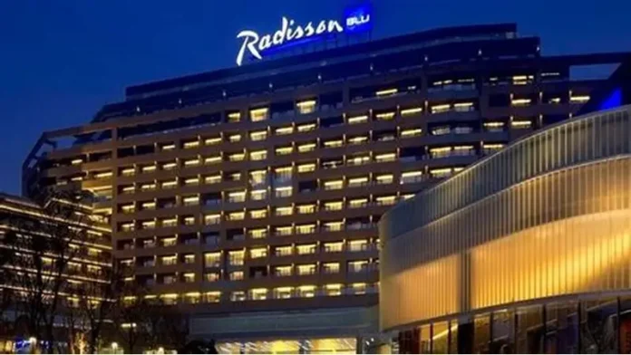 Radisson Hotel Group has reached a significant milestone in Africa, with more than 100 hotels across the continent in operation and under development. Radisson Blu continues to anchor the legacy footprint. At the same time, the Radisson brand is the fastest riser, supported by a strong conversion engine and a concrete pipeline that continues to translate into openings. Building on this momentum, the Group has signed over 15 new hotels and roughly 2,500 rooms in the last 12 months, including new market entries in the Democratic Republic of Congo and Zimbabwe. This week, Radisson Hotel Group is also attending FHS Africa (www.FutureHospitality.com) in Nairobi, reinforcing its commitment to expanding its presence and strengthening strategic partnerships across the continent. Over the past five years, Radisson and Radisson Blu have ranked among the most signed brands in Africa, with one of the highest shares of cumulative openings. The last 12 months set a new benchmark with more than 2,500 rooms signed and multiple market entries. Priority growth markets remain Morocco, South Africa, and Nigeria, where the Group is deepening its presence and widening its brand distribution. Ramsay Rankoussi, Regional Chief Development Officer, Radisson Hotel Group, commented: “We’ve crossed the 100-hotel mark in Africa by staying true to our plan, focusing on where we can lead, moving fast on quality conversions, and partnering with owners who share our ambition. The next phase is about depth in Morocco and Nigeria, a smarter footprint in South Africa, and a stronger resort offering that matches where travelers want to go. Our pipeline is built to open, not just to announce. That is why our conversion share is high, our time to market is short, and our brands are gaining ground in the cities and resort destinations that matter most.” Nigeria shows the model’s resilience. The Group now holds a strong position in the country with 13 hotels in operation and pipeline, while Abuja is carrying a significant active pipeline with three hotels totaling 458 keys. South Africa is being reshaped with priorities in Cape Town, targeted growth in secondary cities such as Durban and Pretoria, and a sharper focus on leisure corridors that include Kruger National Park, Sun City, and the Garden Route. The Group plans to enter Zanzibar and is considering lodge, safari, and affiliation opportunities across Namibia, Botswana, and Zambia to meet the rising demand for nature-led experiences. Conversions remain a core lever for scale and speed. In the last five years, more than 15 hotels, equal to almost 3,000 rooms, joined the portfolio through conversion. This helped the Group lead openings across the continent while keeping brand standards high and owners in mind. Recent signings show the extensiveness of this strategy, with a balanced pipeline of city hotels, resort destinations, and quick-to-market conversions. These signings span the Democratic Republic of Congo, Nigeria, Zimbabwe, and Morocco, including Radisson Blu Kinshasa and three Radisson hotels in Lubumbashi, Radisson Harare, Park Inn Victoria Falls, Radisson Collection Lagos Atlantic, as well as new additions in Casablanca with Radisson Blu Resort & Conference Center Bouskoura, a first Radisson brand hotel in Rabat, and further expansion in Marrakech. Key signings include: Democratic Republic of the Congo Radisson Blu Hotel, Kinshasa Upper-upscale flagship in Gombe Opening late 2026. Set on Boulevard Colonel Tshatshi in the Gombe district, the hotel will offer 110 keys, including suites and a Presidential Suite. Guests can choose from a lobby bar, an all-day dining restaurant, and a pool bar. Wellness includes a gym, massage rooms, and an outdoor pool with a terrace. Meetings and events feature a modern event hall with a pre-function area. The address is well connected, 32 kilometers from N’djili International Airport, 10 kilometers from N’Dolo Airport, and 6 kilometers from Gare Centrale. Radisson Hotel Lubumbashi Panoramic city stay in the DRC’s second city Opening mid-2027. Located on Revolution Road Avenue, the hotel will feature 97 keys, including junior suites and a Presidential Suite. Dining spans a lobby bar, an all-day dining venue, and a rooftop bar and grill with city views. Three flexible meeting rooms and a pre-function area support business and social events. Facilities include a gym and a swimming pool. The location sits near Kipopo Lake, Lubumbashi Golf Club, and La Plage, and is 12 kilometers from Luano International Airport. Radisson Blu Apartments Lubumbashi Upscale apartment living in Lubumbashi’s prestigious Quartier Golf Targeted for 2030. A 160-room property located in Quartier Golf, one of Lubumbashi’s most upscale residential districts, near Kipopo Lake and surrounded by luxury homes and key landmarks including Lubumbashi Golf and La Plage. Planned amenities include a specialty restaurant and bar, a pool bar, and a gym, offering a premium stay experience for extended-stay and leisure travelers. Radisson Airport Hotel Lubumbashi A strategically located airport hotel designed for ease and connectivity Set to open in 2028, this 105-room property will be located just 6 kilometers from Luano International Airport, around a 10-minute drive, making it well positioned for business travelers, transit guests, and airline crews. Planned facilities include a restaurant, lobby bar, pool bar, meeting rooms, and a swimming pool, combining practicality with a welcoming hospitality experience close to the airport. Egypt Radisson Resort Ain Sokhna Groove A large-scale Red Sea resort in one of Egypt’s growing leisure destinations Planned for 2029, Radisson Resort Ain Sokhna Groove will offer 469 rooms, including 50 family rooms, as part of The Groove Ain Sokhna mixed-use development. Located along the Red Sea coast, around 30 kilometers south of Ain Sokhna and approximately 150 kilometers from Cairo, the resort is expected to feature private beach access, a spa, gym and fitness center, several restaurants, plus a ballroom and meeting rooms, catering to both holidaymakers and events demand. Radisson Serviced Apartments COY Sheikh Zayed City Flexible extended-stay accommodation in a fast-growing hub of Greater Cairo Expected to open in 2030, this 120-key serviced apartments property, including six one-bedroom units, will form part of the COY development in Sheikh Zayed City. With a location just 13 kilometers from Sphinx International Airport and 14 kilometers from the Great Pyramids of Giza, the development sits close to major commercial, leisure, education, and healthcare destinations. Planned amenities include a coffee lounge, bar, kiosk, and meeting and event space integrated into the wider co-working environment. Morocco Radisson Blu Hotel & Conference Center, Casablanc a Bouskoura Conference-ready address beside Palm Golf A 119-key hotel with eight suites, a rooftop restaurant, and a dedicated conference center. Event facilities include two boardrooms, while a spa and a large outdoor pool cater to leisure travelers. The hotel is located 20 kilometers from Mohammed V International Airport and next to Palm Golf Palmeraie Country Club. Radisson Hotel & Apartments Rabat Technopolis Dual-component hub in the capital’s innovation park A two-building project in Technopolis, 25 minutes from central Rabat. The hotel will offer 140 rooms, four dining venues, a pool, and a meeting and events space. The adjacent serviced apartment building adds 56 units. Technopolis connects businesses with leading education and research centers, creating a strong base for corporate demand. Radisson Blu Resort Marrakech Ben Akil Low-rise bungalows with views of Atlas Mountains Opening early 2028. A 17-hectare estate featuring 80 bungalow-style accommodations, each with an outdoor terrace. Larger typologies include private pools. The resort sits beside Royal Golf Marrakech and is a 15-minute drive from the city center. Nigeria Radisson Hotel Aba A new internationally branded hospitality destination for Aba Targeted for 2031, Radisson Hotel Aba will introduce 120 rooms, including six junior suites, in a prime riverside location along the Aba River near key transport corridors. The hotel will become the first Radisson-branded property in Aba and the Group’s third branded hotel in Nigeria. Plans for the hotel include a gym, swimming pool, and several meeting rooms, serving both business and local demand. Sam Mbakwe International Airport in Owerri is approximately 56 kilometers away, or a 1 hour and 10 minute drive. Radisson Hotel & Conference Center Yenagoa A conference-focused hotel in the heart of an emerging Nigerian business center Scheduled for 2027, the property will feature 196 rooms, including 16 junior suites, four executive suites, and two Presidential Suites, in Yenagoa, a city that is steadily strengthening its role as an administrative and commercial hub in southern Nigeria. Located near government institutions, business districts, and Bayelsa International Airport, approximately 33 kilometers or 40 minutes away, the hotel is set to benefit from the area’s ongoing infrastructure and hospitality growth while meeting rising demand for accommodation, meetings, and large-scale events. Radisson Collection Hotel, Lagos Atlantic Refined lifestyle luxury on the oceanfront of Lagos’ leading business district Targeted for 2029, Radisson Collection Hotel, Lagos Atlantic will feature 107 rooms, including 16 executive suites and one Presidential Suite, on a prime oceanfront site on Victoria Island. As Lagos’ main financial and commercial district, Victoria Island is home to multinational companies, corporate headquarters, embassies, and strong year-round business activity. Located approximately 33 kilometers from Murtala Muhammed International Airport, around a 45-minute drive, the hotel will mark the second Radisson Collection property in Lagos. South Africa Radisson Serviced Apartments Umhlanga A modern serviced apartment offering in the heart of Umhlanga’s business district Planned for 2029, Radisson Serviced Apartments Umhlanga will introduce 155 rooms in a newly built development within Umhlanga Ridge, one of the area’s most established commercial and lifestyle hubs. The property will be within walking distance of Gateway Theatre of Shopping and close to major office precincts, including Umhlanga Ridge Business Park, La Lucia Office Park, and Glass House Office Park. Comprising studios and apartments, the project is designed to meet growing demand for high-quality extended-stay accommodation in the district. Zimbabwe New market entry Radisson Serviced Apartments, Harare Prime Borrowdale address for extended stays Targeted for end-2028. A 147-key serviced apartments project within a master development near Maxwell Road in Borrowdale. The neighborhood is known for luxury residences, upscale shopping at Sam Levy’s Village, and entertainment at Borrowdale Racecourse. Planned amenities include a café and bar, a gym with sauna, and a pool with a deck. Set to be the only internationally branded hotel apartment offering in the area. Park Inn by Radisson Victoria Falls Resort A resort destination near one of the world’s most iconic natural landmarks Expected to open in 2029, Park Inn by Radisson Victoria Falls Resort will offer 150 rooms, including five suites, in a setting overlooking Zambezi National Park. Located just 5 kilometers from Victoria Falls, around a 10-minute drive, the resort will be ideally positioned near one of the Seven Natural Wonders of the World, a destination that attracts more than 350,000 international visitors each year. With year-round waterfall views, adventure tourism, and access to safari experiences in the surrounding national parks, the property will cater to both leisure travelers and tour groups. Victoria Falls Airport is located approximately 22 kilometers, or a 23-minute drive, away. Leading with the most diverse footprint across the continent, with presence in more than 30 African countries, Radisson Hotel Group blends depth in focus markets with selective entry into new destinations each year.