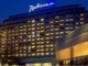 Radisson Hotel Group has reached a significant milestone in Africa, with more than 100 hotels across the continent in operation and under development. Radisson Blu continues to anchor the legacy footprint. At the same time, the Radisson brand is the fastest riser, supported by a strong conversion engine and a concrete pipeline that continues to translate into openings. Building on this momentum, the Group has signed over 15 new hotels and roughly 2,500 rooms in the last 12 months, including new market entries in the Democratic Republic of Congo and Zimbabwe. This week, Radisson Hotel Group is also attending FHS Africa (www.FutureHospitality.com) in Nairobi, reinforcing its commitment to expanding its presence and strengthening strategic partnerships across the continent. Over the past five years, Radisson and Radisson Blu have ranked among the most signed brands in Africa, with one of the highest shares of cumulative openings. The last 12 months set a new benchmark with more than 2,500 rooms signed and multiple market entries. Priority growth markets remain Morocco, South Africa, and Nigeria, where the Group is deepening its presence and widening its brand distribution. Ramsay Rankoussi, Regional Chief Development Officer, Radisson Hotel Group, commented: “We’ve crossed the 100-hotel mark in Africa by staying true to our plan, focusing on where we can lead, moving fast on quality conversions, and partnering with owners who share our ambition. The next phase is about depth in Morocco and Nigeria, a smarter footprint in South Africa, and a stronger resort offering that matches where travelers want to go. Our pipeline is built to open, not just to announce. That is why our conversion share is high, our time to market is short, and our brands are gaining ground in the cities and resort destinations that matter most.” Nigeria shows the model’s resilience. The Group now holds a strong position in the country with 13 hotels in operation and pipeline, while Abuja is carrying a significant active pipeline with three hotels totaling 458 keys. South Africa is being reshaped with priorities in Cape Town, targeted growth in secondary cities such as Durban and Pretoria, and a sharper focus on leisure corridors that include Kruger National Park, Sun City, and the Garden Route. The Group plans to enter Zanzibar and is considering lodge, safari, and affiliation opportunities across Namibia, Botswana, and Zambia to meet the rising demand for nature-led experiences. Conversions remain a core lever for scale and speed. In the last five years, more than 15 hotels, equal to almost 3,000 rooms, joined the portfolio through conversion. This helped the Group lead openings across the continent while keeping brand standards high and owners in mind. Recent signings show the extensiveness of this strategy, with a balanced pipeline of city hotels, resort destinations, and quick-to-market conversions. These signings span the Democratic Republic of Congo, Nigeria, Zimbabwe, and Morocco, including Radisson Blu Kinshasa and three Radisson hotels in Lubumbashi, Radisson Harare, Park Inn Victoria Falls, Radisson Collection Lagos Atlantic, as well as new additions in Casablanca with Radisson Blu Resort & Conference Center Bouskoura, a first Radisson brand hotel in Rabat, and further expansion in Marrakech. Key signings include: Democratic Republic of the Congo Radisson Blu Hotel, Kinshasa Upper-upscale flagship in Gombe Opening late 2026. Set on Boulevard Colonel Tshatshi in the Gombe district, the hotel will offer 110 keys, including suites and a Presidential Suite. Guests can choose from a lobby bar, an all-day dining restaurant, and a pool bar. Wellness includes a gym, massage rooms, and an outdoor pool with a terrace. Meetings and events feature a modern event hall with a pre-function area. The address is well connected, 32 kilometers from N’djili International Airport, 10 kilometers from N’Dolo Airport, and 6 kilometers from Gare Centrale. Radisson Hotel Lubumbashi Panoramic city stay in the DRC’s second city Opening mid-2027. Located on Revolution Road Avenue, the hotel will feature 97 keys, including junior suites and a Presidential Suite. Dining spans a lobby bar, an all-day dining venue, and a rooftop bar and grill with city views. Three flexible meeting rooms and a pre-function area support business and social events. Facilities include a gym and a swimming pool. The location sits near Kipopo Lake, Lubumbashi Golf Club, and La Plage, and is 12 kilometers from Luano International Airport. Radisson Blu Apartments Lubumbashi Upscale apartment living in Lubumbashi’s prestigious Quartier Golf Targeted for 2030. A 160-room property located in Quartier Golf, one of Lubumbashi’s most upscale residential districts, near Kipopo Lake and surrounded by luxury homes and key landmarks including Lubumbashi Golf and La Plage. Planned amenities include a specialty restaurant and bar, a pool bar, and a gym, offering a premium stay experience for extended-stay and leisure travelers. Radisson Airport Hotel Lubumbashi A strategically located airport hotel designed for ease and connectivity Set to open in 2028, this 105-room property will be located just 6 kilometers from Luano International Airport, around a 10-minute drive, making it well positioned for business travelers, transit guests, and airline crews. Planned facilities include a restaurant, lobby bar, pool bar, meeting rooms, and a swimming pool, combining practicality with a welcoming hospitality experience close to the airport. Egypt Radisson Resort Ain Sokhna Groove A large-scale Red Sea resort in one of Egypt’s growing leisure destinations Planned for 2029, Radisson Resort Ain Sokhna Groove will offer 469 rooms, including 50 family rooms, as part of The Groove Ain Sokhna mixed-use development. Located along the Red Sea coast, around 30 kilometers south of Ain Sokhna and approximately 150 kilometers from Cairo, the resort is expected to feature private beach access, a spa, gym and fitness center, several restaurants, plus a ballroom and meeting rooms, catering to both holidaymakers and events demand. Radisson Serviced Apartments COY Sheikh Zayed City Flexible extended-stay accommodation in a fast-growing hub of Greater Cairo Expected to open in 2030, this 120-key serviced apartments property, including six one-bedroom units, will form part of the COY development in Sheikh Zayed City. With a location just 13 kilometers from Sphinx International Airport and 14 kilometers from the Great Pyramids of Giza, the development sits close to major commercial, leisure, education, and healthcare destinations. Planned amenities include a coffee lounge, bar, kiosk, and meeting and event space integrated into the wider co-working environment. Morocco Radisson Blu Hotel & Conference Center, Casablanc a Bouskoura Conference-ready address beside Palm Golf A 119-key hotel with eight suites, a rooftop restaurant, and a dedicated conference center. Event facilities include two boardrooms, while a spa and a large outdoor pool cater to leisure travelers. The hotel is located 20 kilometers from Mohammed V International Airport and next to Palm Golf Palmeraie Country Club. Radisson Hotel & Apartments Rabat Technopolis Dual-component hub in the capital’s innovation park A two-building project in Technopolis, 25 minutes from central Rabat. The hotel will offer 140 rooms, four dining venues, a pool, and a meeting and events space. The adjacent serviced apartment building adds 56 units. Technopolis connects businesses with leading education and research centers, creating a strong base for corporate demand. Radisson Blu Resort Marrakech Ben Akil Low-rise bungalows with views of Atlas Mountains Opening early 2028. A 17-hectare estate featuring 80 bungalow-style accommodations, each with an outdoor terrace. Larger typologies include private pools. The resort sits beside Royal Golf Marrakech and is a 15-minute drive from the city center. Nigeria Radisson Hotel Aba A new internationally branded hospitality destination for Aba Targeted for 2031, Radisson Hotel Aba will introduce 120 rooms, including six junior suites, in a prime riverside location along the Aba River near key transport corridors. The hotel will become the first Radisson-branded property in Aba and the Group’s third branded hotel in Nigeria. Plans for the hotel include a gym, swimming pool, and several meeting rooms, serving both business and local demand. Sam Mbakwe International Airport in Owerri is approximately 56 kilometers away, or a 1 hour and 10 minute drive. Radisson Hotel & Conference Center Yenagoa A conference-focused hotel in the heart of an emerging Nigerian business center Scheduled for 2027, the property will feature 196 rooms, including 16 junior suites, four executive suites, and two Presidential Suites, in Yenagoa, a city that is steadily strengthening its role as an administrative and commercial hub in southern Nigeria. Located near government institutions, business districts, and Bayelsa International Airport, approximately 33 kilometers or 40 minutes away, the hotel is set to benefit from the area’s ongoing infrastructure and hospitality growth while meeting rising demand for accommodation, meetings, and large-scale events. Radisson Collection Hotel, Lagos Atlantic Refined lifestyle luxury on the oceanfront of Lagos’ leading business district Targeted for 2029, Radisson Collection Hotel, Lagos Atlantic will feature 107 rooms, including 16 executive suites and one Presidential Suite, on a prime oceanfront site on Victoria Island. As Lagos’ main financial and commercial district, Victoria Island is home to multinational companies, corporate headquarters, embassies, and strong year-round business activity. Located approximately 33 kilometers from Murtala Muhammed International Airport, around a 45-minute drive, the hotel will mark the second Radisson Collection property in Lagos. South Africa Radisson Serviced Apartments Umhlanga A modern serviced apartment offering in the heart of Umhlanga’s business district Planned for 2029, Radisson Serviced Apartments Umhlanga will introduce 155 rooms in a newly built development within Umhlanga Ridge, one of the area’s most established commercial and lifestyle hubs. The property will be within walking distance of Gateway Theatre of Shopping and close to major office precincts, including Umhlanga Ridge Business Park, La Lucia Office Park, and Glass House Office Park. Comprising studios and apartments, the project is designed to meet growing demand for high-quality extended-stay accommodation in the district. Zimbabwe New market entry Radisson Serviced Apartments, Harare Prime Borrowdale address for extended stays Targeted for end-2028. A 147-key serviced apartments project within a master development near Maxwell Road in Borrowdale. The neighborhood is known for luxury residences, upscale shopping at Sam Levy’s Village, and entertainment at Borrowdale Racecourse. Planned amenities include a café and bar, a gym with sauna, and a pool with a deck. Set to be the only internationally branded hotel apartment offering in the area. Park Inn by Radisson Victoria Falls Resort A resort destination near one of the world’s most iconic natural landmarks Expected to open in 2029, Park Inn by Radisson Victoria Falls Resort will offer 150 rooms, including five suites, in a setting overlooking Zambezi National Park. Located just 5 kilometers from Victoria Falls, around a 10-minute drive, the resort will be ideally positioned near one of the Seven Natural Wonders of the World, a destination that attracts more than 350,000 international visitors each year. With year-round waterfall views, adventure tourism, and access to safari experiences in the surrounding national parks, the property will cater to both leisure travelers and tour groups. Victoria Falls Airport is located approximately 22 kilometers, or a 23-minute drive, away. Leading with the most diverse footprint across the continent, with presence in more than 30 African countries, Radisson Hotel Group blends depth in focus markets with selective entry into new destinations each year.