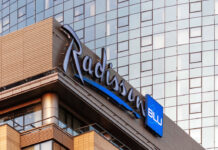 Radisson Hotel Group has reached a significant milestone in Africa, with more than 100 hotels across the continent in operation and under development. Radisson Blu continues to anchor the legacy footprint. At the same time, the Radisson brand is the fastest riser, supported by a strong conversion engine and a concrete pipeline that continues to translate into openings. Building on this momentum, the Group has signed over 15 new hotels and roughly 2,500 rooms in the last 12 months, including new market entries in the Democratic Republic of Congo and Zimbabwe. This week, Radisson Hotel Group is also attending FHS Africa (www.FutureHospitality.com) in Nairobi, reinforcing its commitment to expanding its presence and strengthening strategic partnerships across the continent. Over the past five years, Radisson and Radisson Blu have ranked among the most signed brands in Africa, with one of the highest shares of cumulative openings. The last 12 months set a new benchmark with more than 2,500 rooms signed and multiple market entries. Priority growth markets remain Morocco, South Africa, and Nigeria, where the Group is deepening its presence and widening its brand distribution. Ramsay Rankoussi, Regional Chief Development Officer, Radisson Hotel Group, commented: “We’ve crossed the 100-hotel mark in Africa by staying true to our plan, focusing on where we can lead, moving fast on quality conversions, and partnering with owners who share our ambition. The next phase is about depth in Morocco and Nigeria, a smarter footprint in South Africa, and a stronger resort offering that matches where travelers want to go. Our pipeline is built to open, not just to announce. That is why our conversion share is high, our time to market is short, and our brands are gaining ground in the cities and resort destinations that matter most.” Nigeria shows the model’s resilience. The Group now holds a strong position in the country with 13 hotels in operation and pipeline, while Abuja is carrying a significant active pipeline with three hotels totaling 458 keys. South Africa is being reshaped with priorities in Cape Town, targeted growth in secondary cities such as Durban and Pretoria, and a sharper focus on leisure corridors that include Kruger National Park, Sun City, and the Garden Route. The Group plans to enter Zanzibar and is considering lodge, safari, and affiliation opportunities across Namibia, Botswana, and Zambia to meet the rising demand for nature-led experiences. Conversions remain a core lever for scale and speed. In the last five years, more than 15 hotels, equal to almost 3,000 rooms, joined the portfolio through conversion. This helped the Group lead openings across the continent while keeping brand standards high and owners in mind. Recent signings show the extensiveness of this strategy, with a balanced pipeline of city hotels, resort destinations, and quick-to-market conversions. These signings span the Democratic Republic of Congo, Nigeria, Zimbabwe, and Morocco, including Radisson Blu Kinshasa and three Radisson hotels in Lubumbashi, Radisson Harare, Park Inn Victoria Falls, Radisson Collection Lagos Atlantic, as well as new additions in Casablanca with Radisson Blu Resort & Conference Center Bouskoura, a first Radisson brand hotel in Rabat, and further expansion in Marrakech. Key signings include: Democratic Republic of the Congo Radisson Blu Hotel, Kinshasa Upper-upscale flagship in Gombe Opening late 2026. Set on Boulevard Colonel Tshatshi in the Gombe district, the hotel will offer 110 keys, including suites and a Presidential Suite. Guests can choose from a lobby bar, an all-day dining restaurant, and a pool bar. Wellness includes a gym, massage rooms, and an outdoor pool with a terrace. Meetings and events feature a modern event hall with a pre-function area. The address is well connected, 32 kilometers from N’djili International Airport, 10 kilometers from N’Dolo Airport, and 6 kilometers from Gare Centrale. Radisson Hotel Lubumbashi Panoramic city stay in the DRC’s second city Opening mid-2027. Located on Revolution Road Avenue, the hotel will feature 97 keys, including junior suites and a Presidential Suite. Dining spans a lobby bar, an all-day dining venue, and a rooftop bar and grill with city views. Three flexible meeting rooms and a pre-function area support business and social events. Facilities include a gym and a swimming pool. The location sits near Kipopo Lake, Lubumbashi Golf Club, and La Plage, and is 12 kilometers from Luano International Airport. Radisson Blu Apartments Lubumbashi Upscale apartment living in Lubumbashi’s prestigious Quartier Golf Targeted for 2030. A 160-room property located in Quartier Golf, one of Lubumbashi’s most upscale residential districts, near Kipopo Lake and surrounded by luxury homes and key landmarks including Lubumbashi Golf and La Plage. Planned amenities include a specialty restaurant and bar, a pool bar, and a gym, offering a premium stay experience for extended-stay and leisure travelers. Radisson Airport Hotel Lubumbashi A strategically located airport hotel designed for ease and connectivity Set to open in 2028, this 105-room property will be located just 6 kilometers from Luano International Airport, around a 10-minute drive, making it well positioned for business travelers, transit guests, and airline crews. Planned facilities include a restaurant, lobby bar, pool bar, meeting rooms, and a swimming pool, combining practicality with a welcoming hospitality experience close to the airport. Egypt Radisson Resort Ain Sokhna Groove A large-scale Red Sea resort in one of Egypt’s growing leisure destinations Planned for 2029, Radisson Resort Ain Sokhna Groove will offer 469 rooms, including 50 family rooms, as part of The Groove Ain Sokhna mixed-use development. Located along the Red Sea coast, around 30 kilometers south of Ain Sokhna and approximately 150 kilometers from Cairo, the resort is expected to feature private beach access, a spa, gym and fitness center, several restaurants, plus a ballroom and meeting rooms, catering to both holidaymakers and events demand. Radisson Serviced Apartments COY Sheikh Zayed City Flexible extended-stay accommodation in a fast-growing hub of Greater Cairo Expected to open in 2030, this 120-key serviced apartments property, including six one-bedroom units, will form part of the COY development in Sheikh Zayed City. With a location just 13 kilometers from Sphinx International Airport and 14 kilometers from the Great Pyramids of Giza, the development sits close to major commercial, leisure, education, and healthcare destinations. Planned amenities include a coffee lounge, bar, kiosk, and meeting and event space integrated into the wider co-working environment. Morocco Radisson Blu Hotel & Conference Center, Casablanc a Bouskoura Conference-ready address beside Palm Golf A 119-key hotel with eight suites, a rooftop restaurant, and a dedicated conference center. Event facilities include two boardrooms, while a spa and a large outdoor pool cater to leisure travelers. The hotel is located 20 kilometers from Mohammed V International Airport and next to Palm Golf Palmeraie Country Club. Radisson Hotel & Apartments Rabat Technopolis Dual-component hub in the capital’s innovation park A two-building project in Technopolis, 25 minutes from central Rabat. The hotel will offer 140 rooms, four dining venues, a pool, and a meeting and events space. The adjacent serviced apartment building adds 56 units. Technopolis connects businesses with leading education and research centers, creating a strong base for corporate demand. Radisson Blu Resort Marrakech Ben Akil Low-rise bungalows with views of Atlas Mountains Opening early 2028. A 17-hectare estate featuring 80 bungalow-style accommodations, each with an outdoor terrace. Larger typologies include private pools. The resort sits beside Royal Golf Marrakech and is a 15-minute drive from the city center. Nigeria Radisson Hotel Aba A new internationally branded hospitality destination for Aba Targeted for 2031, Radisson Hotel Aba will introduce 120 rooms, including six junior suites, in a prime riverside location along the Aba River near key transport corridors. The hotel will become the first Radisson-branded property in Aba and the Group’s third branded hotel in Nigeria. Plans for the hotel include a gym, swimming pool, and several meeting rooms, serving both business and local demand. Sam Mbakwe International Airport in Owerri is approximately 56 kilometers away, or a 1 hour and 10 minute drive. Radisson Hotel & Conference Center Yenagoa A conference-focused hotel in the heart of an emerging Nigerian business center Scheduled for 2027, the property will feature 196 rooms, including 16 junior suites, four executive suites, and two Presidential Suites, in Yenagoa, a city that is steadily strengthening its role as an administrative and commercial hub in southern Nigeria. Located near government institutions, business districts, and Bayelsa International Airport, approximately 33 kilometers or 40 minutes away, the hotel is set to benefit from the area’s ongoing infrastructure and hospitality growth while meeting rising demand for accommodation, meetings, and large-scale events. Radisson Collection Hotel, Lagos Atlantic Refined lifestyle luxury on the oceanfront of Lagos’ leading business district Targeted for 2029, Radisson Collection Hotel, Lagos Atlantic will feature 107 rooms, including 16 executive suites and one Presidential Suite, on a prime oceanfront site on Victoria Island. As Lagos’ main financial and commercial district, Victoria Island is home to multinational companies, corporate headquarters, embassies, and strong year-round business activity. Located approximately 33 kilometers from Murtala Muhammed International Airport, around a 45-minute drive, the hotel will mark the second Radisson Collection property in Lagos. South Africa Radisson Serviced Apartments Umhlanga A modern serviced apartment offering in the heart of Umhlanga’s business district Planned for 2029, Radisson Serviced Apartments Umhlanga will introduce 155 rooms in a newly built development within Umhlanga Ridge, one of the area’s most established commercial and lifestyle hubs. The property will be within walking distance of Gateway Theatre of Shopping and close to major office precincts, including Umhlanga Ridge Business Park, La Lucia Office Park, and Glass House Office Park. Comprising studios and apartments, the project is designed to meet growing demand for high-quality extended-stay accommodation in the district. Zimbabwe New market entry Radisson Serviced Apartments, Harare Prime Borrowdale address for extended stays Targeted for end-2028. A 147-key serviced apartments project within a master development near Maxwell Road in Borrowdale. The neighborhood is known for luxury residences, upscale shopping at Sam Levy’s Village, and entertainment at Borrowdale Racecourse. Planned amenities include a café and bar, a gym with sauna, and a pool with a deck. Set to be the only internationally branded hotel apartment offering in the area. Park Inn by Radisson Victoria Falls Resort A resort destination near one of the world’s most iconic natural landmarks Expected to open in 2029, Park Inn by Radisson Victoria Falls Resort will offer 150 rooms, including five suites, in a setting overlooking Zambezi National Park. Located just 5 kilometers from Victoria Falls, around a 10-minute drive, the resort will be ideally positioned near one of the Seven Natural Wonders of the World, a destination that attracts more than 350,000 international visitors each year. With year-round waterfall views, adventure tourism, and access to safari experiences in the surrounding national parks, the property will cater to both leisure travelers and tour groups. Victoria Falls Airport is located approximately 22 kilometers, or a 23-minute drive, away. Leading with the most diverse footprint across the continent, with presence in more than 30 African countries, Radisson Hotel Group blends depth in focus markets with selective entry into new destinations each year.