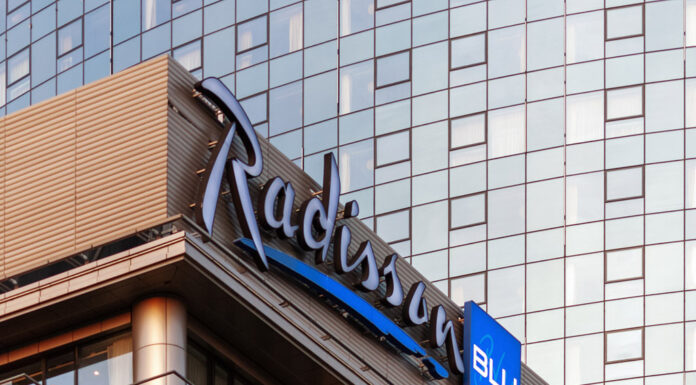 Radisson Hotel Group has reached a significant milestone in Africa, with more than 100 hotels across the continent in operation and under development. Radisson Blu continues to anchor the legacy footprint. At the same time, the Radisson brand is the fastest riser, supported by a strong conversion engine and a concrete pipeline that continues to translate into openings. Building on this momentum, the Group has signed over 15 new hotels and roughly 2,500 rooms in the last 12 months, including new market entries in the Democratic Republic of Congo and Zimbabwe. This week, Radisson Hotel Group is also attending FHS Africa (www.FutureHospitality.com) in Nairobi, reinforcing its commitment to expanding its presence and strengthening strategic partnerships across the continent. Over the past five years, Radisson and Radisson Blu have ranked among the most signed brands in Africa, with one of the highest shares of cumulative openings. The last 12 months set a new benchmark with more than 2,500 rooms signed and multiple market entries. Priority growth markets remain Morocco, South Africa, and Nigeria, where the Group is deepening its presence and widening its brand distribution. Ramsay Rankoussi, Regional Chief Development Officer, Radisson Hotel Group, commented: “We’ve crossed the 100-hotel mark in Africa by staying true to our plan, focusing on where we can lead, moving fast on quality conversions, and partnering with owners who share our ambition. The next phase is about depth in Morocco and Nigeria, a smarter footprint in South Africa, and a stronger resort offering that matches where travelers want to go. Our pipeline is built to open, not just to announce. That is why our conversion share is high, our time to market is short, and our brands are gaining ground in the cities and resort destinations that matter most.” Nigeria shows the model’s resilience. The Group now holds a strong position in the country with 13 hotels in operation and pipeline, while Abuja is carrying a significant active pipeline with three hotels totaling 458 keys. South Africa is being reshaped with priorities in Cape Town, targeted growth in secondary cities such as Durban and Pretoria, and a sharper focus on leisure corridors that include Kruger National Park, Sun City, and the Garden Route. The Group plans to enter Zanzibar and is considering lodge, safari, and affiliation opportunities across Namibia, Botswana, and Zambia to meet the rising demand for nature-led experiences. Conversions remain a core lever for scale and speed. In the last five years, more than 15 hotels, equal to almost 3,000 rooms, joined the portfolio through conversion. This helped the Group lead openings across the continent while keeping brand standards high and owners in mind. Recent signings show the extensiveness of this strategy, with a balanced pipeline of city hotels, resort destinations, and quick-to-market conversions. These signings span the Democratic Republic of Congo, Nigeria, Zimbabwe, and Morocco, including Radisson Blu Kinshasa and three Radisson hotels in Lubumbashi, Radisson Harare, Park Inn Victoria Falls, Radisson Collection Lagos Atlantic, as well as new additions in Casablanca with Radisson Blu Resort & Conference Center Bouskoura, a first Radisson brand hotel in Rabat, and further expansion in Marrakech. Key signings include: Democratic Republic of the Congo Radisson Blu Hotel, Kinshasa Upper-upscale flagship in Gombe Opening late 2026. Set on Boulevard Colonel Tshatshi in the Gombe district, the hotel will offer 110 keys, including suites and a Presidential Suite. Guests can choose from a lobby bar, an all-day dining restaurant, and a pool bar. Wellness includes a gym, massage rooms, and an outdoor pool with a terrace. Meetings and events feature a modern event hall with a pre-function area. The address is well connected, 32 kilometers from N’djili International Airport, 10 kilometers from N’Dolo Airport, and 6 kilometers from Gare Centrale. Radisson Hotel Lubumbashi Panoramic city stay in the DRC’s second city Opening mid-2027. Located on Revolution Road Avenue, the hotel will feature 97 keys, including junior suites and a Presidential Suite. Dining spans a lobby bar, an all-day dining venue, and a rooftop bar and grill with city views. Three flexible meeting rooms and a pre-function area support business and social events. Facilities include a gym and a swimming pool. The location sits near Kipopo Lake, Lubumbashi Golf Club, and La Plage, and is 12 kilometers from Luano International Airport. Radisson Blu Apartments Lubumbashi Upscale apartment living in Lubumbashi’s prestigious Quartier Golf Targeted for 2030. A 160-room property located in Quartier Golf, one of Lubumbashi’s most upscale residential districts, near Kipopo Lake and surrounded by luxury homes and key landmarks including Lubumbashi Golf and La Plage. Planned amenities include a specialty restaurant and bar, a pool bar, and a gym, offering a premium stay experience for extended-stay and leisure travelers. Radisson Airport Hotel Lubumbashi A strategically located airport hotel designed for ease and connectivity Set to open in 2028, this 105-room property will be located just 6 kilometers from Luano International Airport, around a 10-minute drive, making it well positioned for business travelers, transit guests, and airline crews. Planned facilities include a restaurant, lobby bar, pool bar, meeting rooms, and a swimming pool, combining practicality with a welcoming hospitality experience close to the airport. Egypt Radisson Resort Ain Sokhna Groove A large-scale Red Sea resort in one of Egypt’s growing leisure destinations Planned for 2029, Radisson Resort Ain Sokhna Groove will offer 469 rooms, including 50 family rooms, as part of The Groove Ain Sokhna mixed-use development. Located along the Red Sea coast, around 30 kilometers south of Ain Sokhna and approximately 150 kilometers from Cairo, the resort is expected to feature private beach access, a spa, gym and fitness center, several restaurants, plus a ballroom and meeting rooms, catering to both holidaymakers and events demand. Radisson Serviced Apartments COY Sheikh Zayed City Flexible extended-stay accommodation in a fast-growing hub of Greater Cairo Expected to open in 2030, this 120-key serviced apartments property, including six one-bedroom units, will form part of the COY development in Sheikh Zayed City. With a location just 13 kilometers from Sphinx International Airport and 14 kilometers from the Great Pyramids of Giza, the development sits close to major commercial, leisure, education, and healthcare destinations. Planned amenities include a coffee lounge, bar, kiosk, and meeting and event space integrated into the wider co-working environment. Morocco Radisson Blu Hotel & Conference Center, Casablanc a Bouskoura Conference-ready address beside Palm Golf A 119-key hotel with eight suites, a rooftop restaurant, and a dedicated conference center. Event facilities include two boardrooms, while a spa and a large outdoor pool cater to leisure travelers. The hotel is located 20 kilometers from Mohammed V International Airport and next to Palm Golf Palmeraie Country Club. Radisson Hotel & Apartments Rabat Technopolis Dual-component hub in the capital’s innovation park A two-building project in Technopolis, 25 minutes from central Rabat. The hotel will offer 140 rooms, four dining venues, a pool, and a meeting and events space. The adjacent serviced apartment building adds 56 units. Technopolis connects businesses with leading education and research centers, creating a strong base for corporate demand. Radisson Blu Resort Marrakech Ben Akil Low-rise bungalows with views of Atlas Mountains Opening early 2028. A 17-hectare estate featuring 80 bungalow-style accommodations, each with an outdoor terrace. Larger typologies include private pools. The resort sits beside Royal Golf Marrakech and is a 15-minute drive from the city center. Nigeria Radisson Hotel Aba A new internationally branded hospitality destination for Aba Targeted for 2031, Radisson Hotel Aba will introduce 120 rooms, including six junior suites, in a prime riverside location along the Aba River near key transport corridors. The hotel will become the first Radisson-branded property in Aba and the Group’s third branded hotel in Nigeria. Plans for the hotel include a gym, swimming pool, and several meeting rooms, serving both business and local demand. Sam Mbakwe International Airport in Owerri is approximately 56 kilometers away, or a 1 hour and 10 minute drive. Radisson Hotel & Conference Center Yenagoa A conference-focused hotel in the heart of an emerging Nigerian business center Scheduled for 2027, the property will feature 196 rooms, including 16 junior suites, four executive suites, and two Presidential Suites, in Yenagoa, a city that is steadily strengthening its role as an administrative and commercial hub in southern Nigeria. Located near government institutions, business districts, and Bayelsa International Airport, approximately 33 kilometers or 40 minutes away, the hotel is set to benefit from the area’s ongoing infrastructure and hospitality growth while meeting rising demand for accommodation, meetings, and large-scale events. Radisson Collection Hotel, Lagos Atlantic Refined lifestyle luxury on the oceanfront of Lagos’ leading business district Targeted for 2029, Radisson Collection Hotel, Lagos Atlantic will feature 107 rooms, including 16 executive suites and one Presidential Suite, on a prime oceanfront site on Victoria Island. As Lagos’ main financial and commercial district, Victoria Island is home to multinational companies, corporate headquarters, embassies, and strong year-round business activity. Located approximately 33 kilometers from Murtala Muhammed International Airport, around a 45-minute drive, the hotel will mark the second Radisson Collection property in Lagos. South Africa Radisson Serviced Apartments Umhlanga A modern serviced apartment offering in the heart of Umhlanga’s business district Planned for 2029, Radisson Serviced Apartments Umhlanga will introduce 155 rooms in a newly built development within Umhlanga Ridge, one of the area’s most established commercial and lifestyle hubs. The property will be within walking distance of Gateway Theatre of Shopping and close to major office precincts, including Umhlanga Ridge Business Park, La Lucia Office Park, and Glass House Office Park. Comprising studios and apartments, the project is designed to meet growing demand for high-quality extended-stay accommodation in the district. Zimbabwe New market entry Radisson Serviced Apartments, Harare Prime Borrowdale address for extended stays Targeted for end-2028. A 147-key serviced apartments project within a master development near Maxwell Road in Borrowdale. The neighborhood is known for luxury residences, upscale shopping at Sam Levy’s Village, and entertainment at Borrowdale Racecourse. Planned amenities include a café and bar, a gym with sauna, and a pool with a deck. Set to be the only internationally branded hotel apartment offering in the area. Park Inn by Radisson Victoria Falls Resort A resort destination near one of the world’s most iconic natural landmarks Expected to open in 2029, Park Inn by Radisson Victoria Falls Resort will offer 150 rooms, including five suites, in a setting overlooking Zambezi National Park. Located just 5 kilometers from Victoria Falls, around a 10-minute drive, the resort will be ideally positioned near one of the Seven Natural Wonders of the World, a destination that attracts more than 350,000 international visitors each year. With year-round waterfall views, adventure tourism, and access to safari experiences in the surrounding national parks, the property will cater to both leisure travelers and tour groups. Victoria Falls Airport is located approximately 22 kilometers, or a 23-minute drive, away. Leading with the most diverse footprint across the continent, with presence in more than 30 African countries, Radisson Hotel Group blends depth in focus markets with selective entry into new destinations each year.